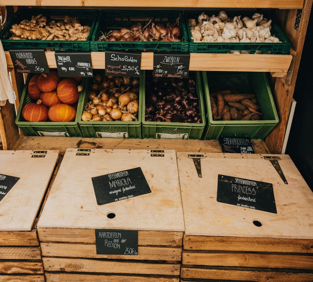 A kitchen counter with fresh produce, reusable containers, and a meal planning notepad.